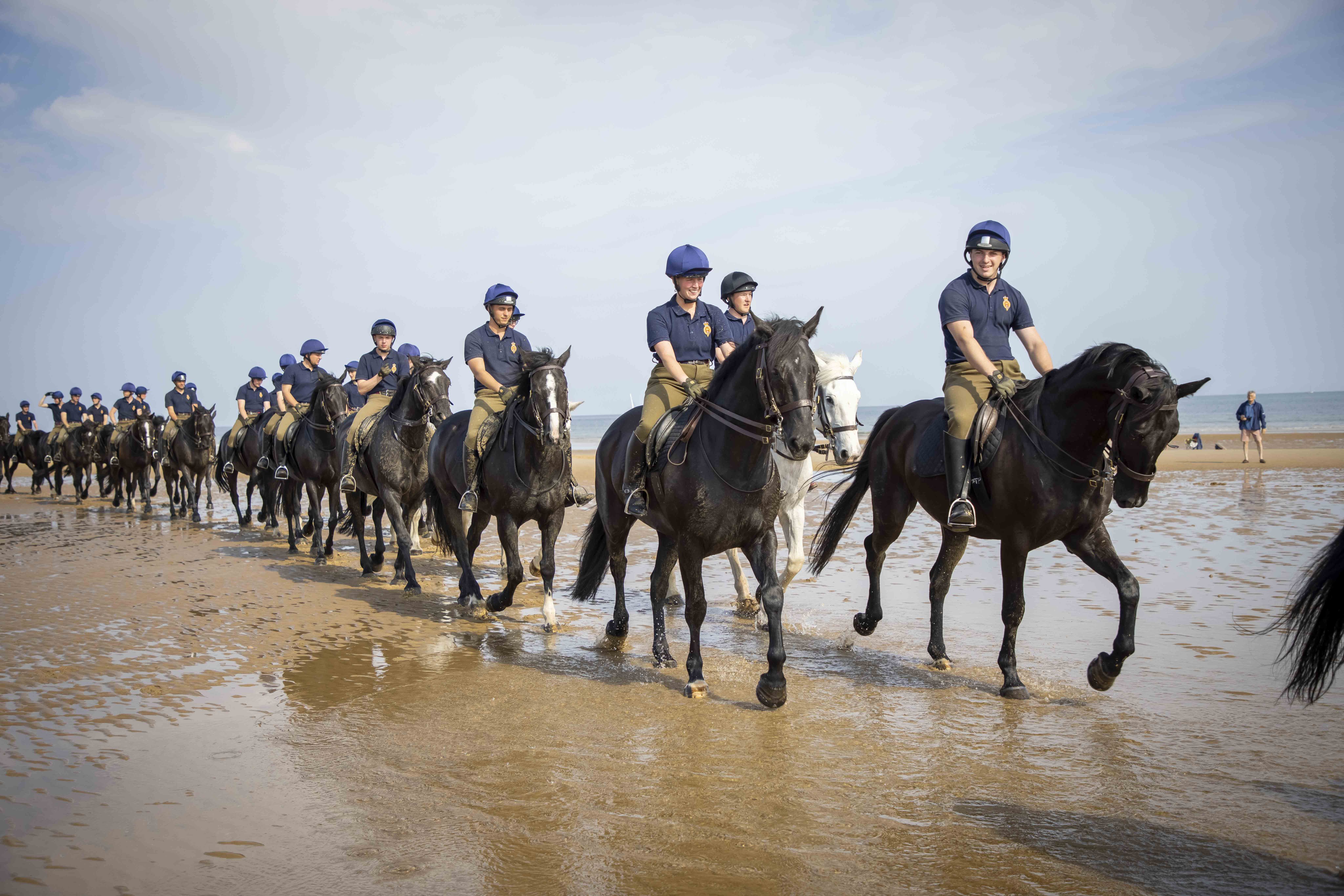 Horses and riders enjoying the beach in Norfolk (Picture: British Army).