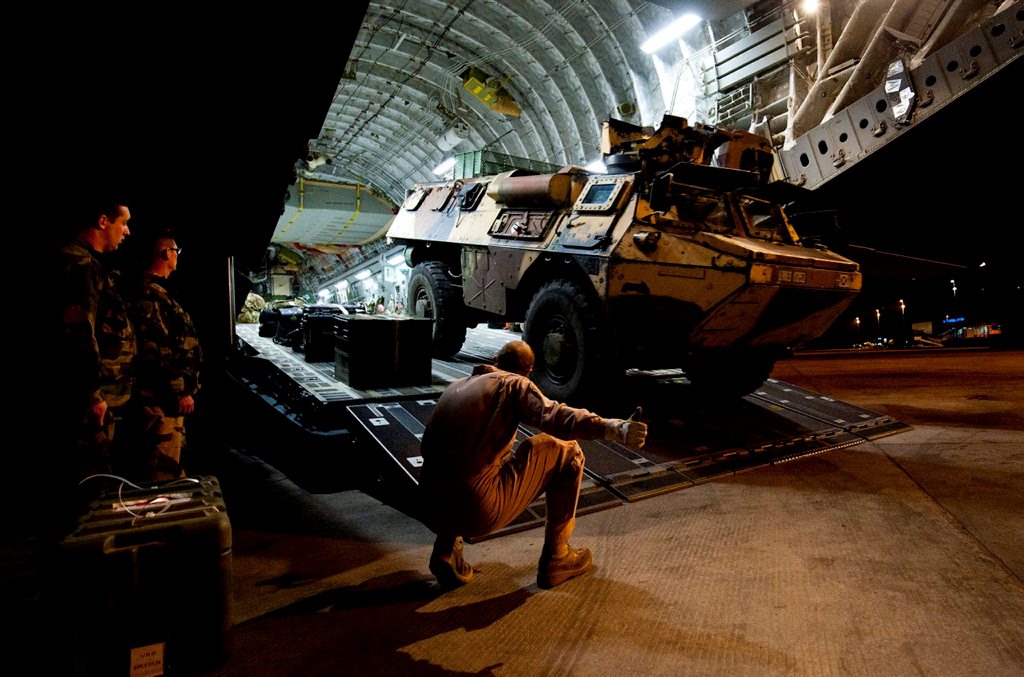 A French Véhicule de l'Avant Blindé (VAB) armoured vehicle being unloaded from a UK C17, which landed at Bamako airport, Mali in support of Operation NEWCOMBE.