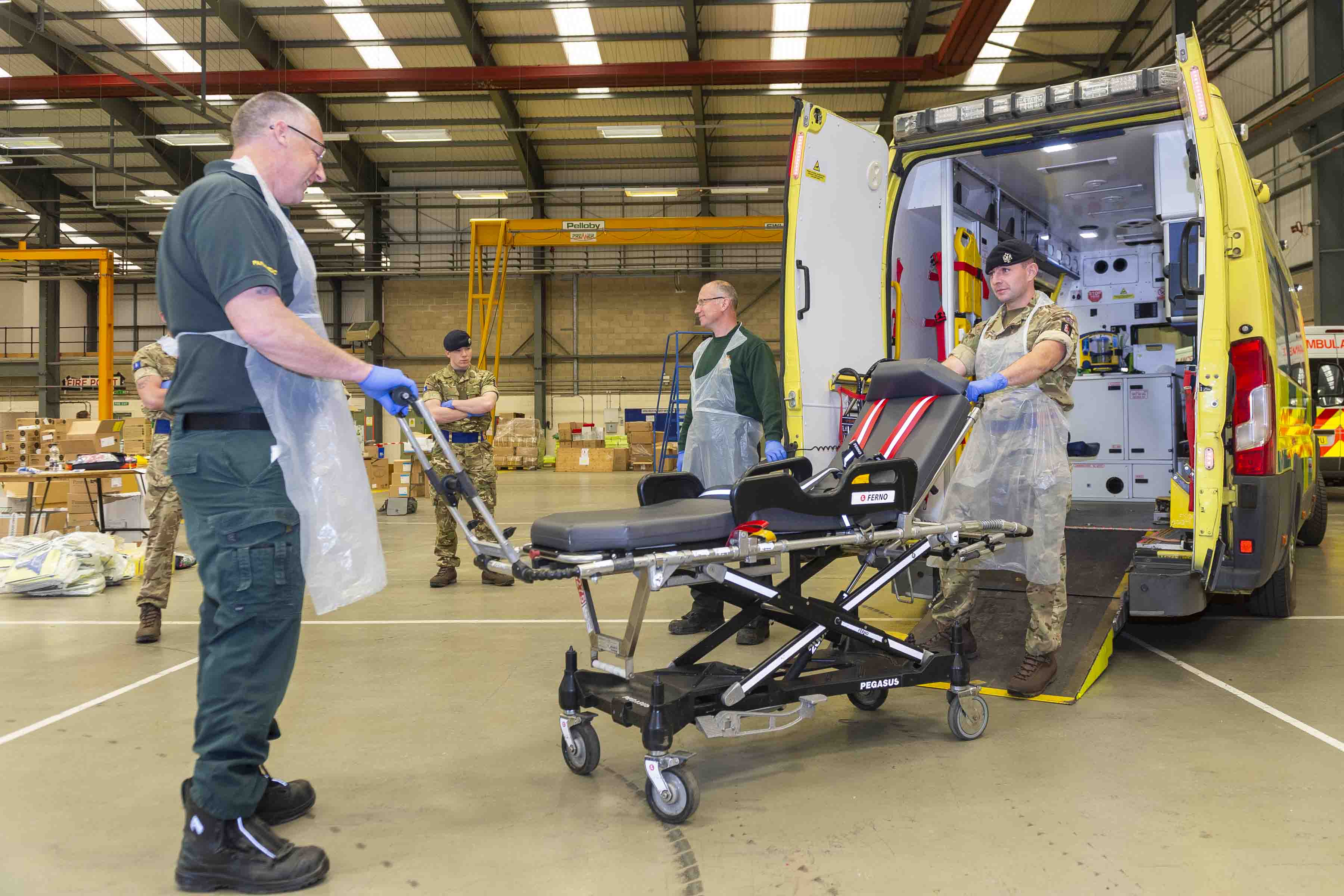 NHS paramedic shows Queen's Dragoons Guard Trooper equipment used in ambulance CREDIT MOD 170420.jpg