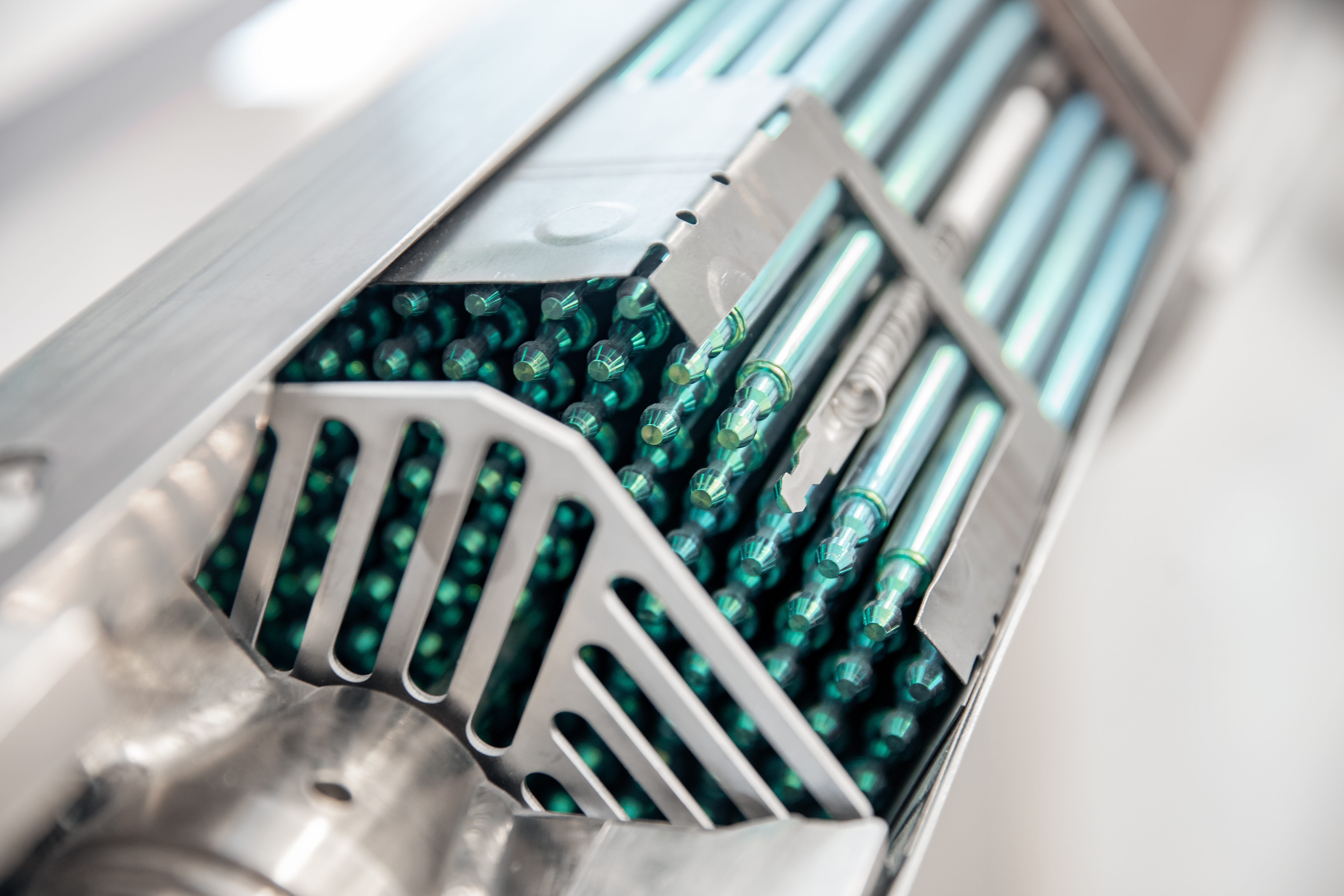 Fragment fuel uranium rod element of nuclear reactor. By Parilov/Shutterstock