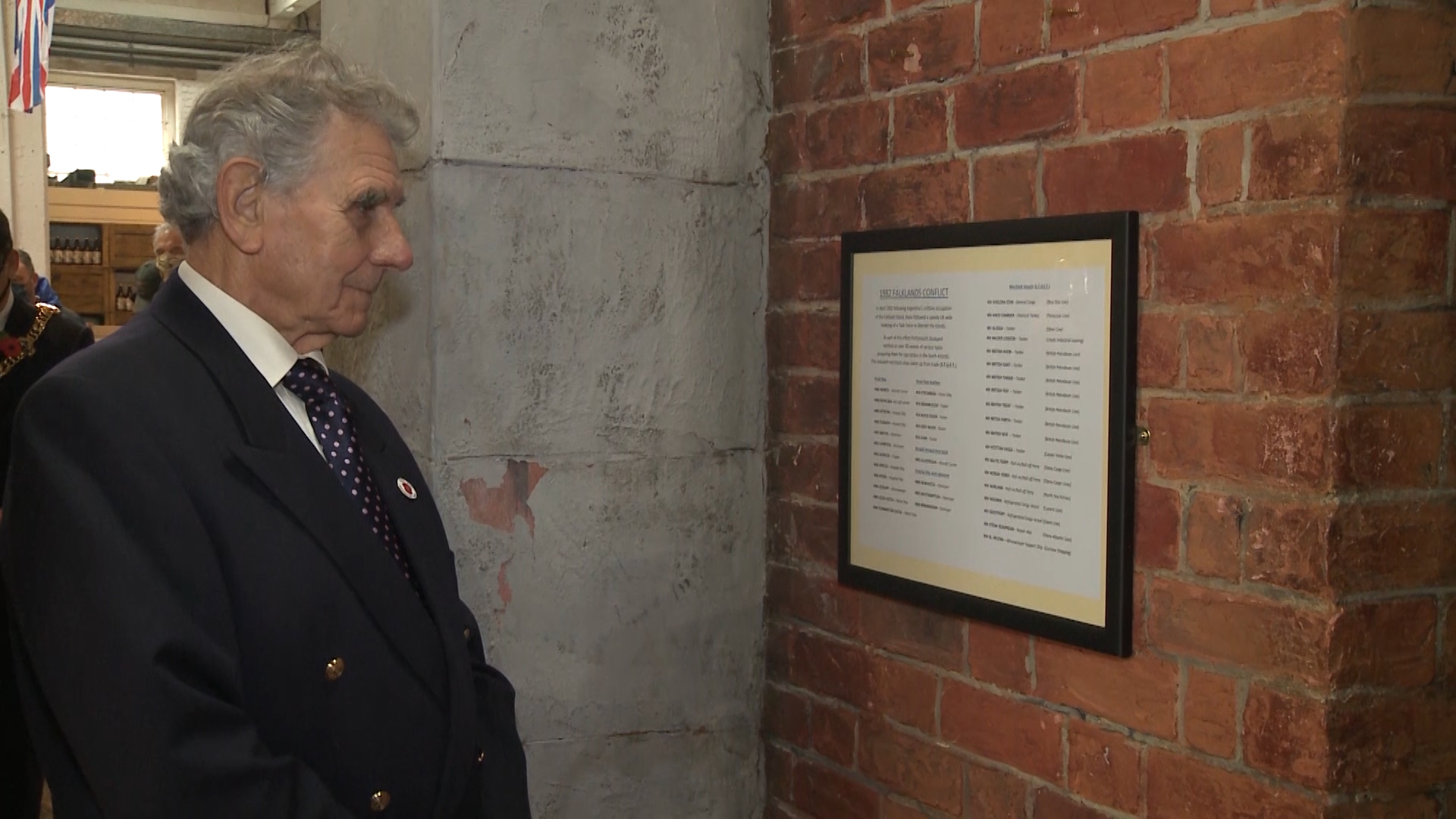 Former Estimator, Grahame Willocks at portsmouth dockyard looks at specs of vessels prepared there for falklands war 301020 CREDIT BFBS.jpg