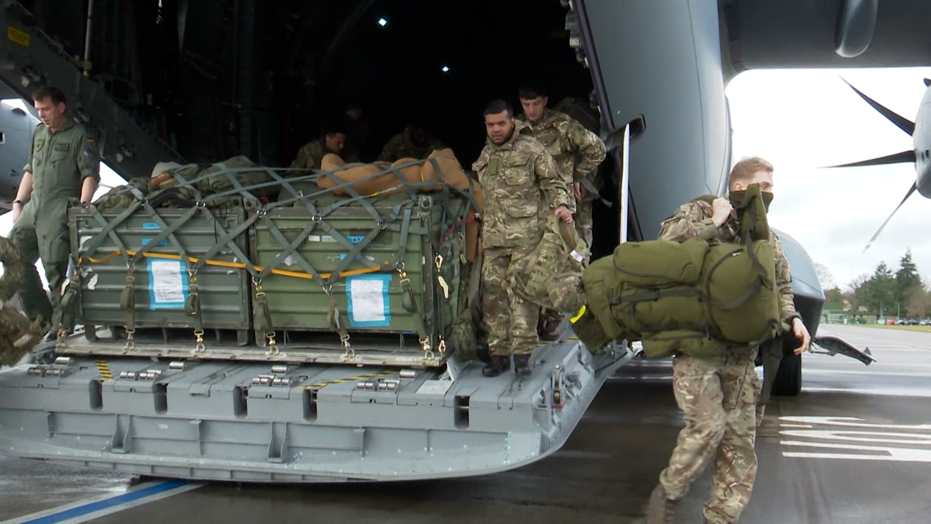 British personnel unloading kit upon arrival in Celle, Germany where they would begin their training.