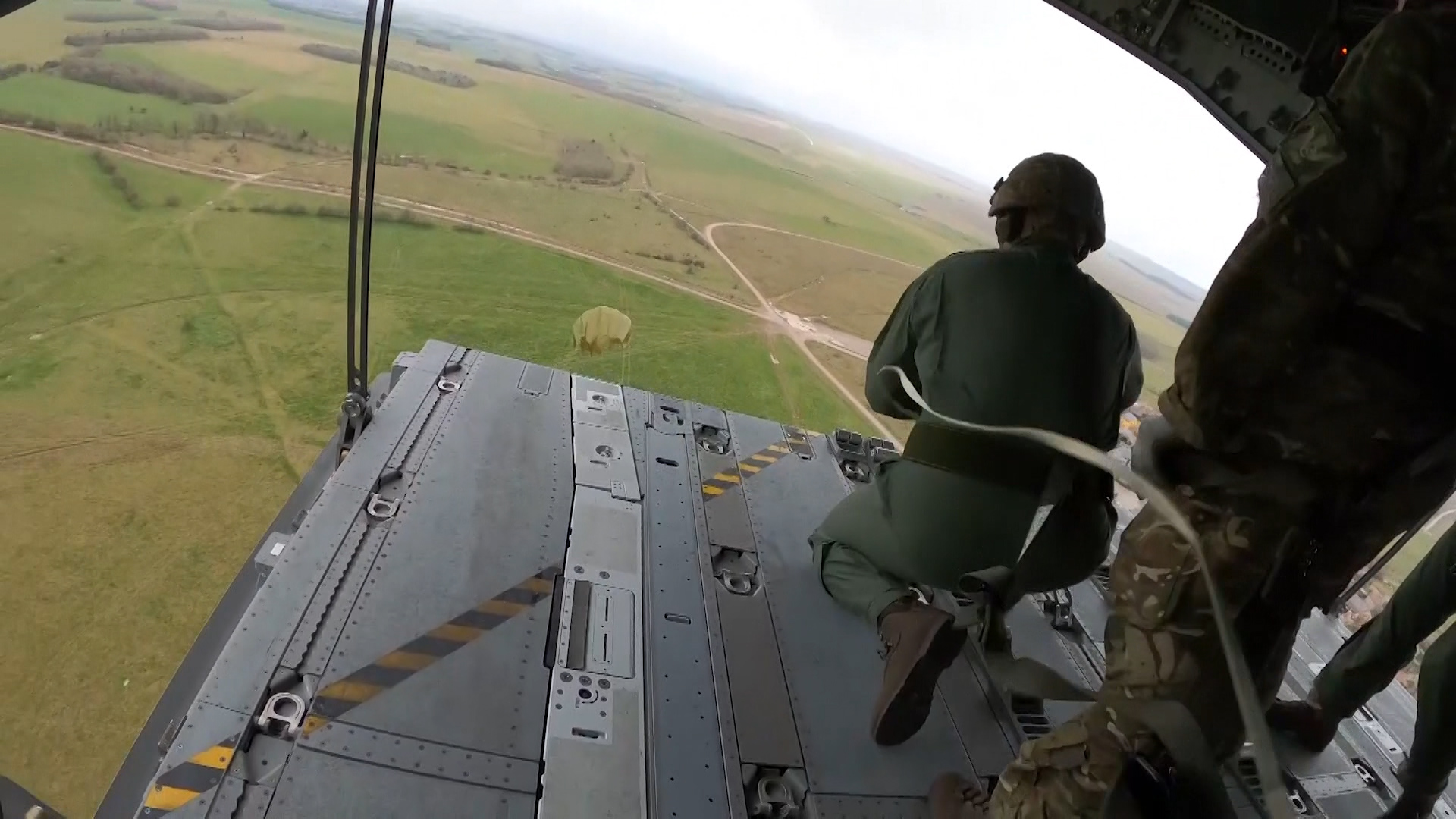 RAF students drop cargo from the back of an A400m Atlas over Brize Norton.