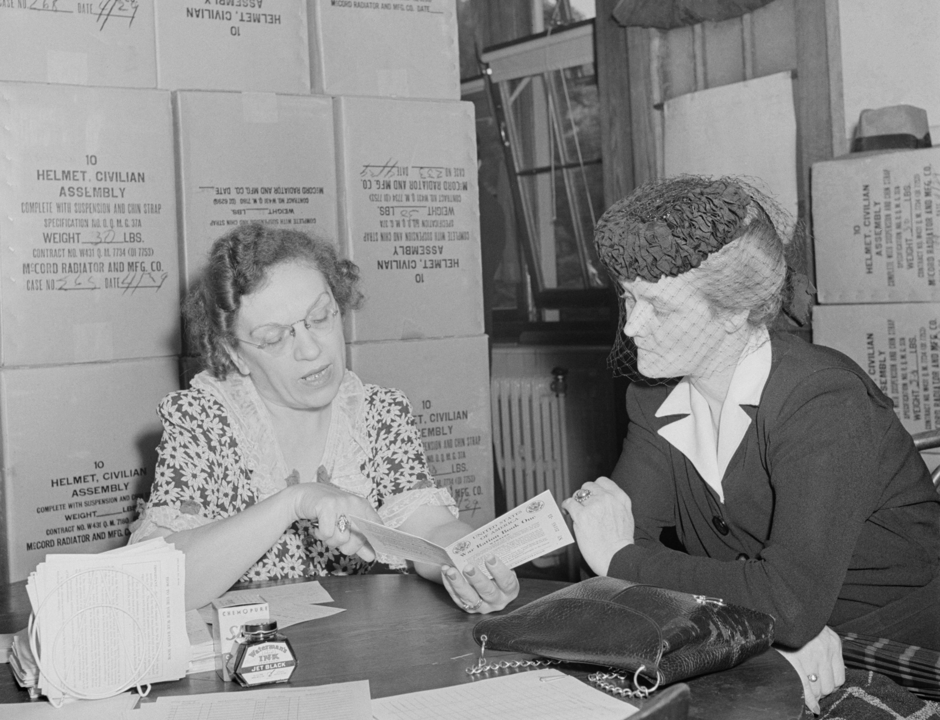 American woman is issued her sugar ration card in Washington, May 1942. Credit: Shutterstock
