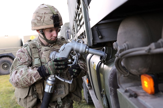 A Royal Marine refuelling a vehicle during Exercise Green Dragon 2016 (Picture: Royal Navy).