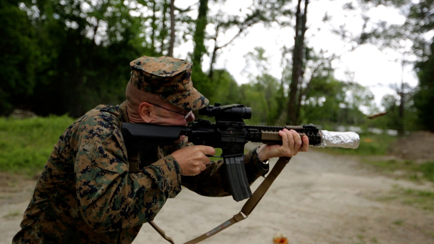 Retired US Marine Corps Chief Warrant Officer 5 Christian Wade attempts to cook bacon using the heat of his gun's suppressor 3 CREDIT US Department of Defense
