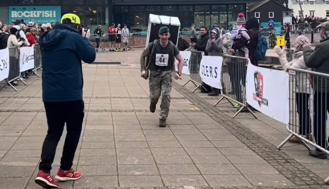 Sam crossing the finish line of the Brighton half marathon (Picture: Sam Hammond).