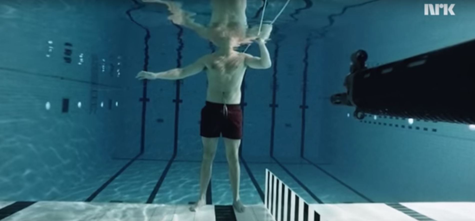 Scientist Experiments With Underwater Assault Rifle