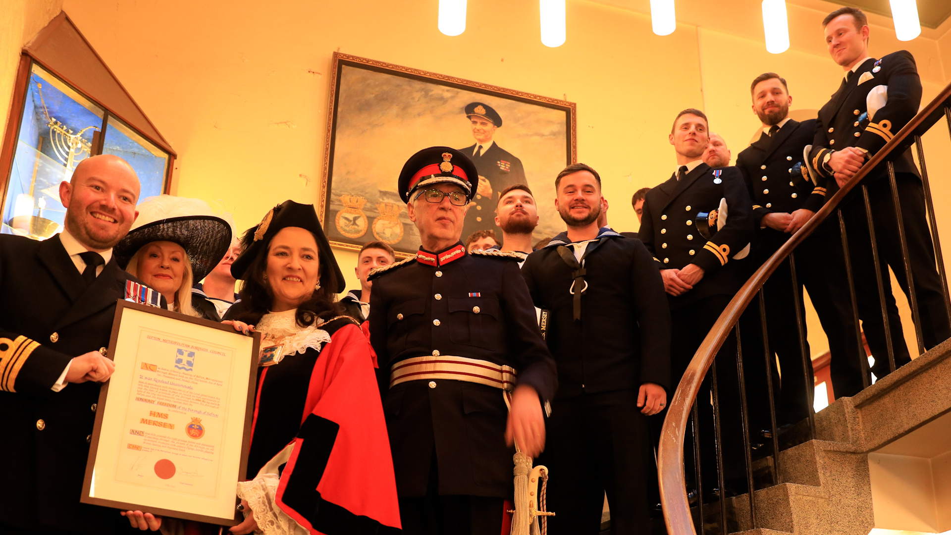 Lieutenant Commander James Mitchell with Clare Carragher, Mayor of Sefton and the crew of HMS Mersey.