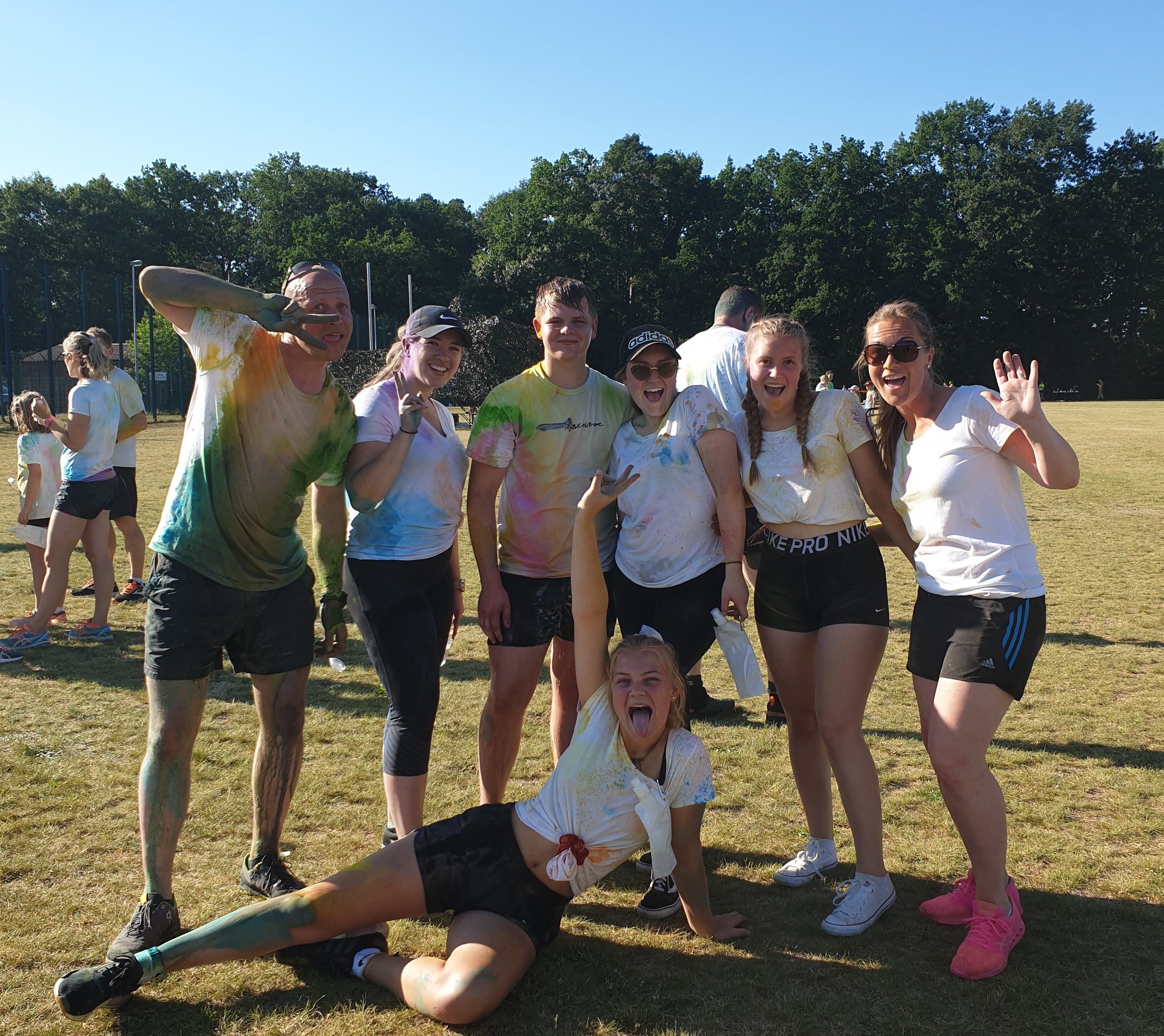 A group of friends posing in their painted T-Shirts after completing the run.