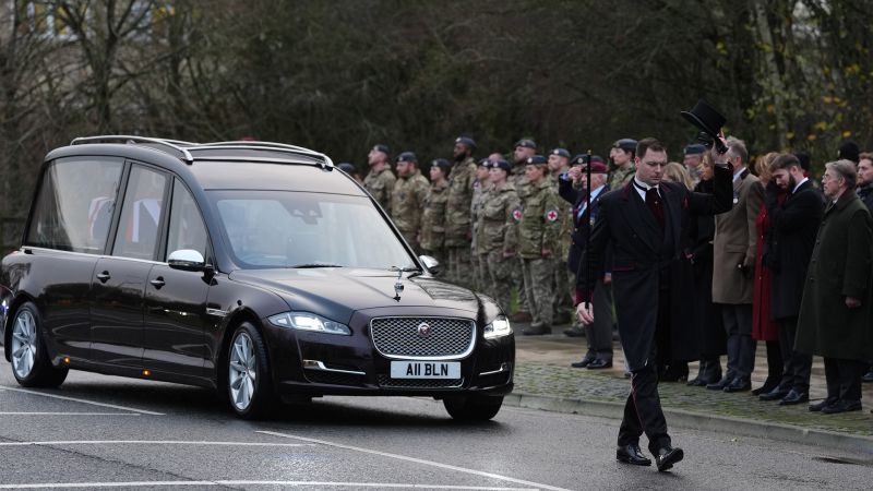 Crowds gather as paratrooper is taken home to the UK following his death in Ukraine