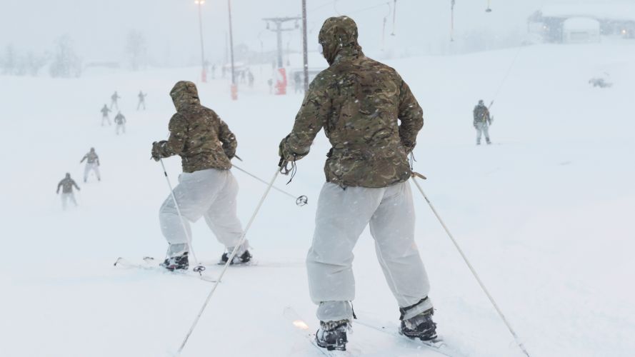 Commandos ski on the slopes during the training