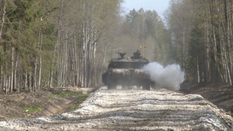 Tanks exercising in woodland terrain of Estonia.