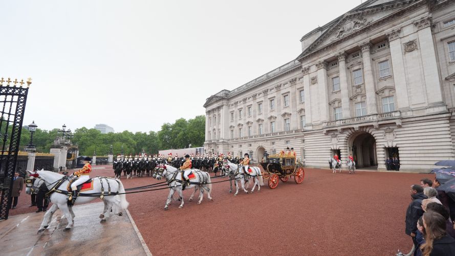 King Charles III and Queen Camilla travel in the Irish State Coach as they depart Buckingham Palace (Picture: PA) 13052026 state opening of parliament cred PA