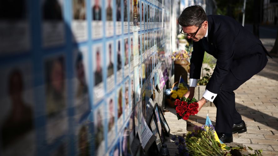 Mr Burnham lays flowers at the Wall of Remembrance at Mykhailivska Square in the old part of Kyiv (Picture: PA) PM Andy Burnham in Kyiv Picture: PA