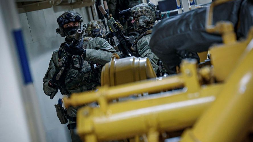 Once onboard, the commandos lined up behind each other in a single-file formation, known as a stack Once onboard, the commandos lined up behind each other in a single-file formation, known as a stack