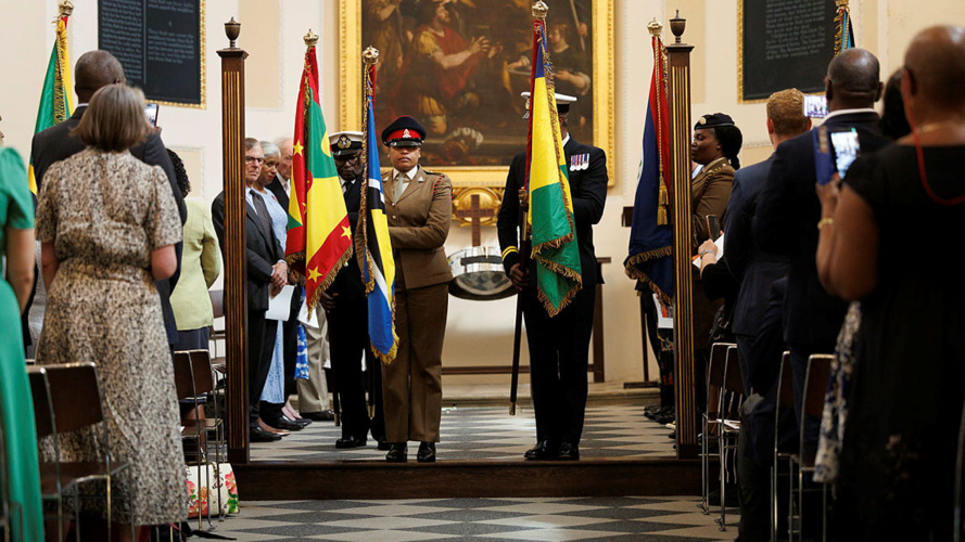 Readings from personnel with Caribbean, Bahamian and Bermudian heritage formed part of the service (Picture: MOD) Flags carried in church service to Caribbean personnel