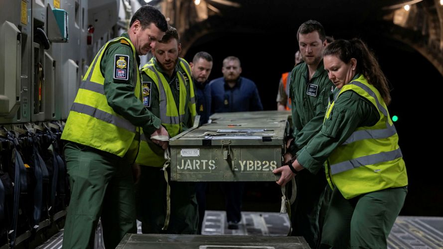 Royal Navy 815 Squadron service personnel loads the Wildcats' rotor blades onto the back of the C-17 - the blades are made of composite materials and are durable, but still need careful handling Royal Navy 815 Squadron service personnel loads the Wildcats' rotor blades onto the back of the C-17 - the blades are made of composite materials and are durable, but still need careful handling