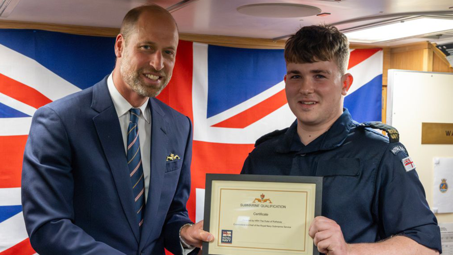 The Prince of Wales presented the Gold Submariner's Dolphin to qualified submariners