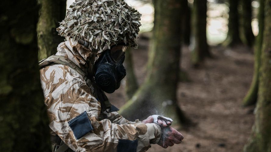 Despite the summer heat, the signallers had to don respirators and protective clothing as part of their CBRN training - this is worn over their uniform, not instead of it Despite the summer heat, the signallers had to don respirators and protective clothing as part of their CBRN training - this is worn over their uniform, not instead of it