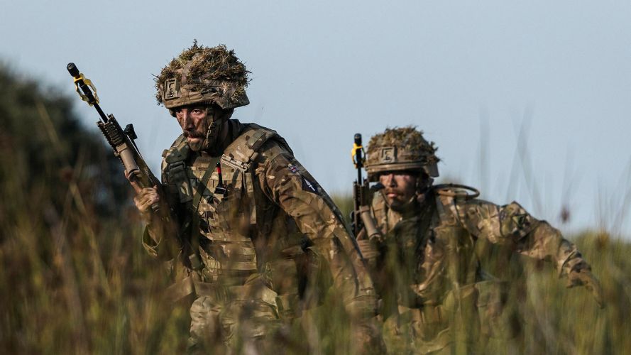 Lance Corporal Forsyth and Signaller Crabbe advance through the tall grass - this will provide some cover from view, but in a real life scenario no protection from incoming rounds Lance Corporal Forsyth and Signaller Crabbe advance through the tall grass - this will provide some cover from view, but in a real life scenario no protection from incoming rounds