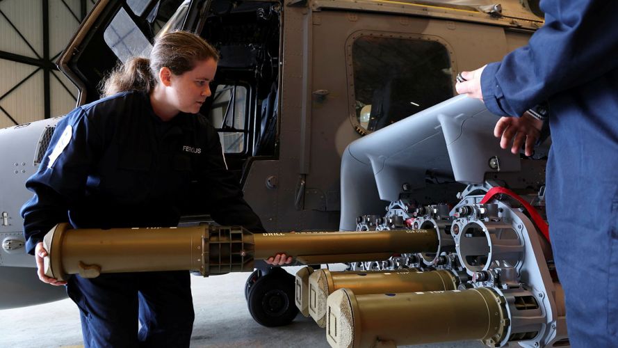 Personnel put Martlet missiles onto the Wildcat helicopter (Picture: Royal Navy) Personnel put Martlet missiles onto the Wildcat helicopter (Picture: Royal Navy)