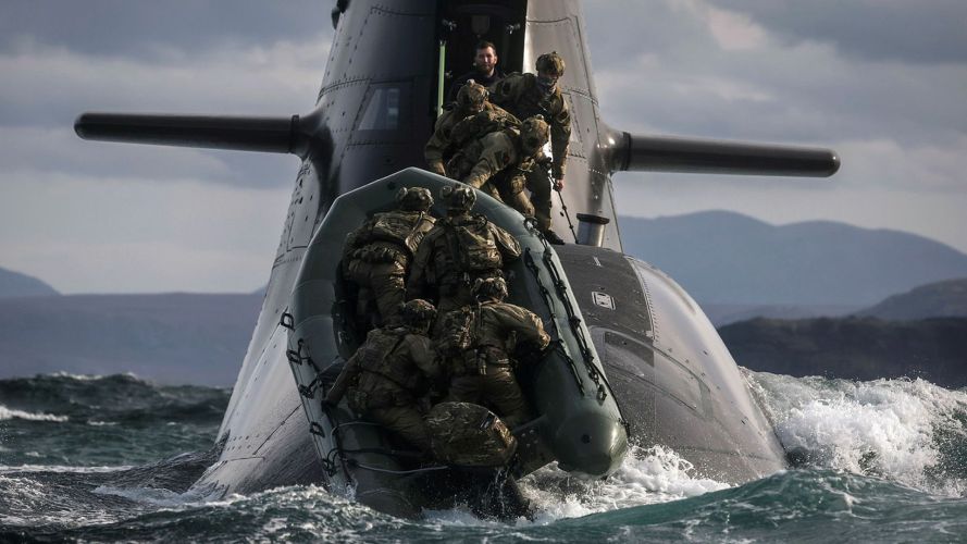 Soldiers from 148 (Meiktila) Commando Forward Observation Battery board a German submarine as they practise their float-on float-off drills off the coast of Cape Wrath Soldiers from 148 (Meiktila) Commando Forward Observation Battery board a German submarine as they practise their float-on float-off drills off the coast of Cape Wrath