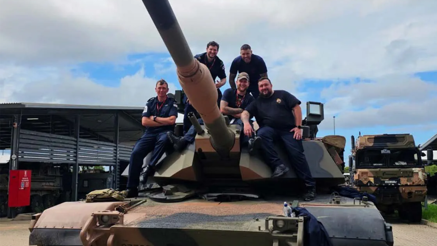 The sailors pose on the tanks turret