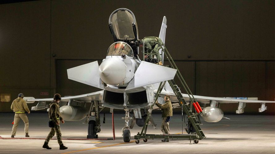 An RAF Typhoon from 11 Squadron based at RAF Coningsby is prepped for its next sortie from Dukhan Air Base in Qatar to offer support in the region