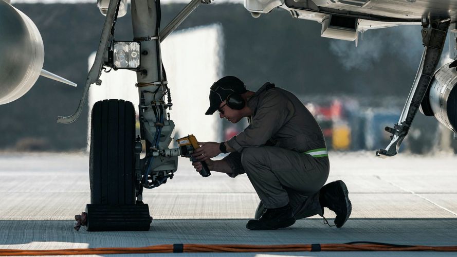 An aircraft technician from 3 (Fighter) Squadron checks the brake temperature on a Typhoon FGR.4 after landing at Borcea 86th Air Base