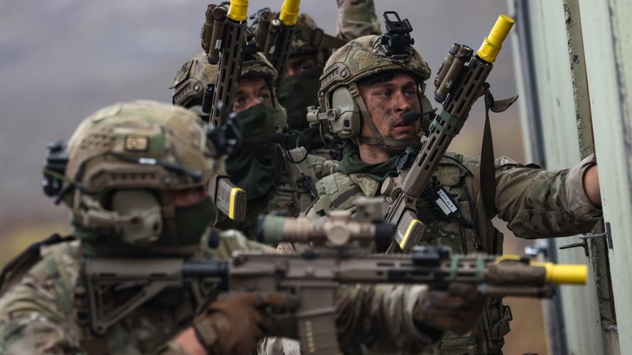 Royal Marines from 40 Commando, armed with their KS-1 assault rifles, clear a building which had been identified as an enemy stronghold by RAF Typhoons during the FIBUA (fighting in built-up areas) phase of Exercise Tarassis