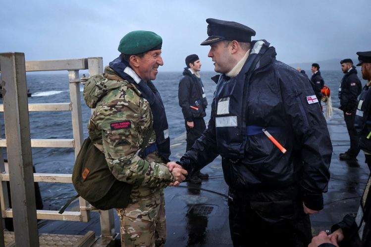 First Sea Lord General Sir Gwyn Jenkins went aboard to personally welcome the submariners home