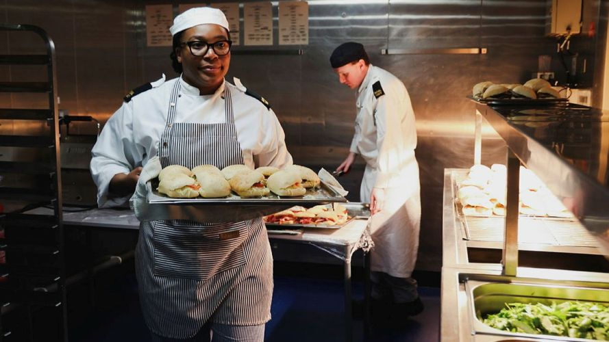 One of HMS Queen Elizabeth's chefs delivers fresh paninis (Picture: MOD) HMS Queen Elizabeth is trialling Generational Change to Feeding (GenChange) and all-day grazing pic MOD