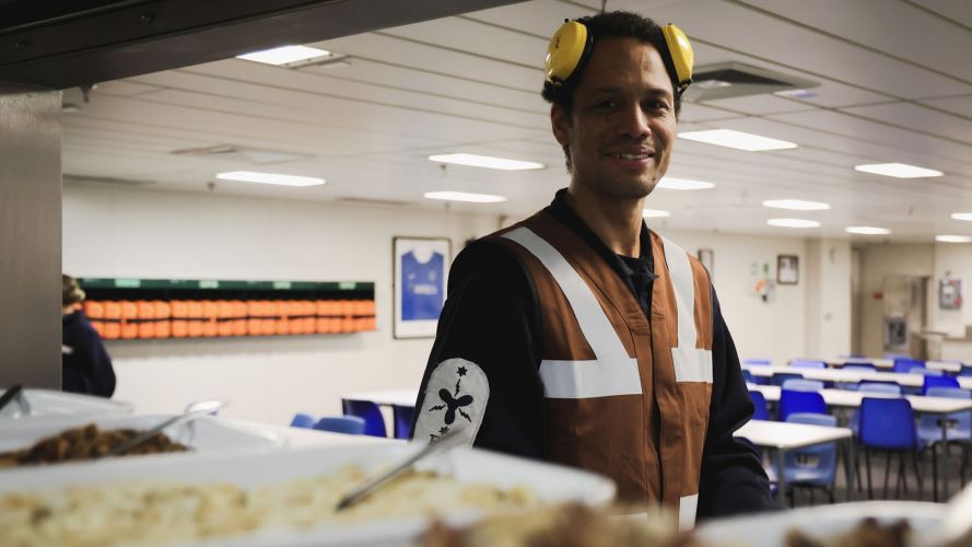 One of the duty marine engineers eyes up the grazing options (Picture: MOD) HMS Queen Elizabeth is trialling Generational change to feeding (GenChange) and all-day grazing pic MOD