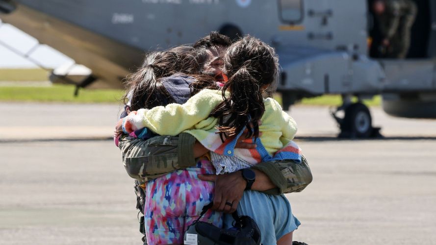 A dad who has just returned from an air defence mission in Cyprus gives his children a big hug (Picture: MOD) A dad who has just returned from an air defence mission in Cyprus gives his children a big hug (Picture: MOD)
