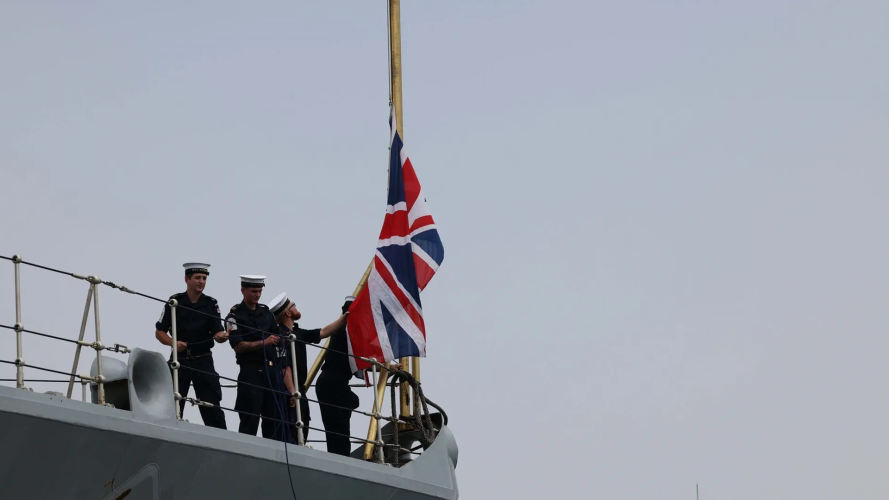 	08102025 Crew from HMS Richmond raise the Union Jack as the ship comes alongside CREDIT ROYAL NAVY