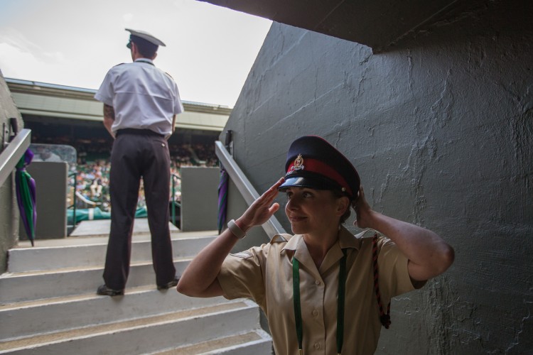 Private Richards adjusts her hat before going to her post on Centre Court