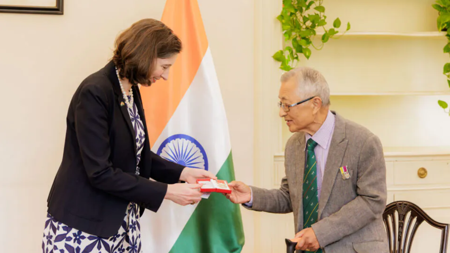 British High Commissioner to India Lindy Cameron presents the British Empire Medal to Satyasagar Ghale
