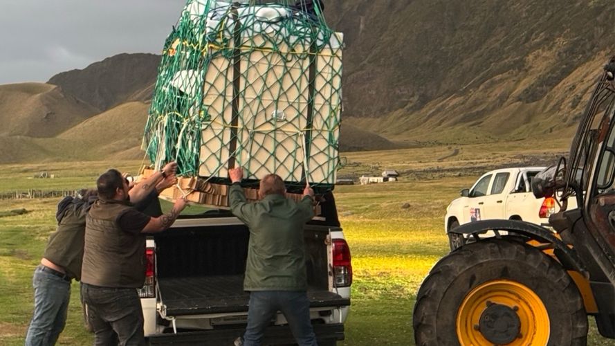 The islanders use a mobile crane to hoist a crate of medical supplies into the back of a truck, ready to be delivered to a medical facility The islanders use a mobile crane to hoist a crate of medical supplies into the back of a truck, ready to be delivered to a medical facility