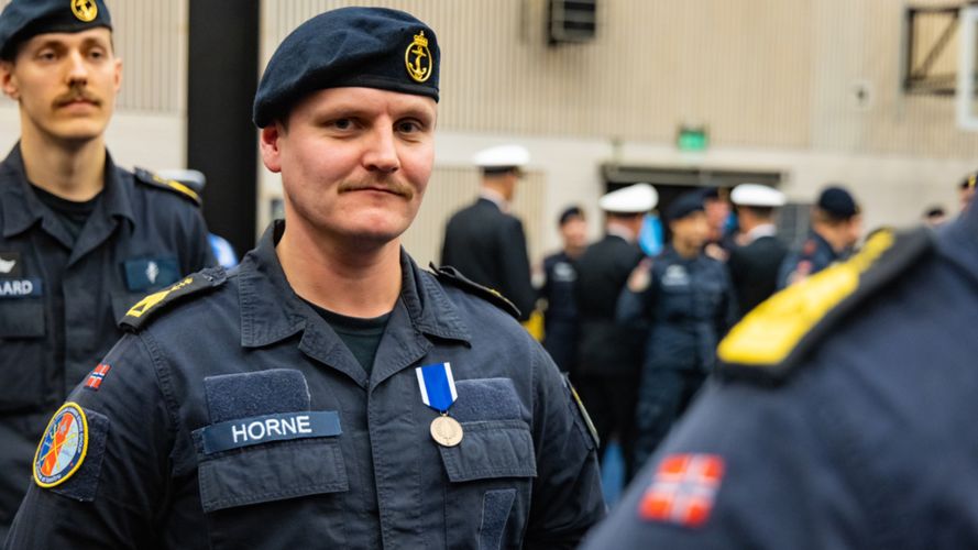 A Norwegian member of personnel stands proudly with his medal (Picture: Edward Valentin Coates/Forsvaret) A Norwegian member of personnel stands proudly with his medal