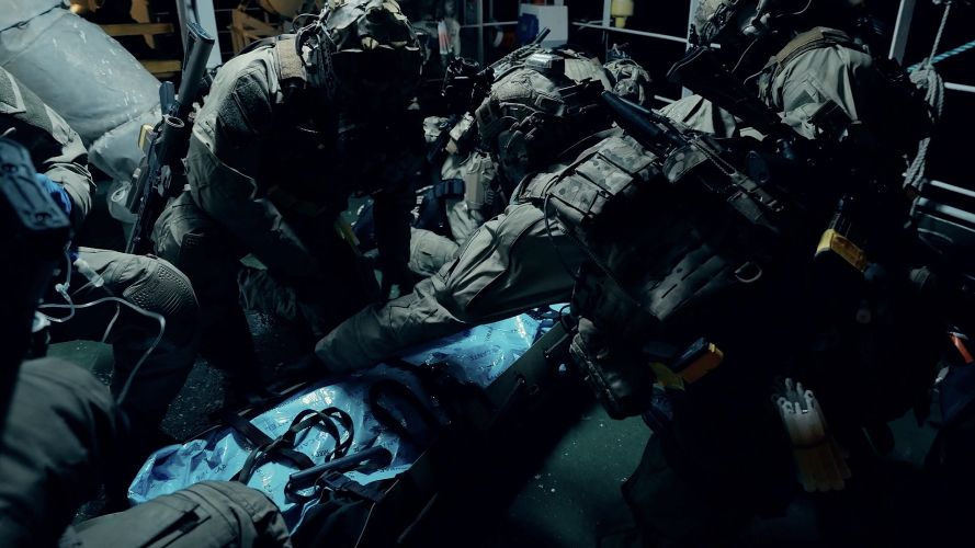 Casualties are moved using lightweight stretchers designed for narrow ship spaces