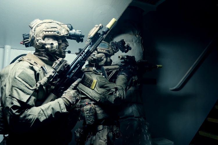 Royal Marines line up behind each other in a single-file formation, known as a stack 