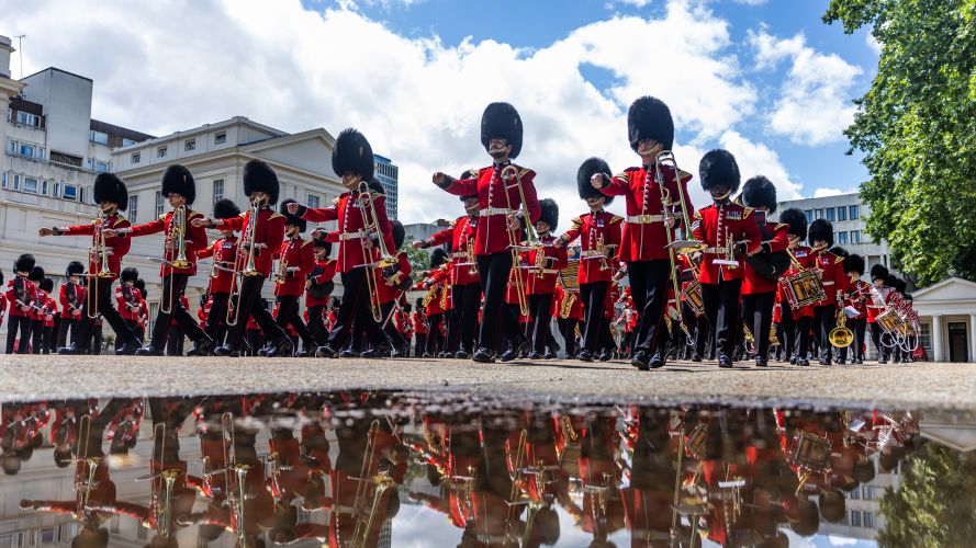 The Batallion, led by the Band of the Grenadier Guards, assembled at Wellington Barracks before marching to Buckingham Palace – regardless of the puddles The Batallion, led by the Band of the Grenadier Guards, assembled at Wellington Barracks before marching to Buckingham Palace - regardless of the puddles