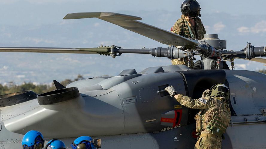 The crew of a Royal  Navy Wildcat HMA2 carry out pre-flight checks before carrying out a sortie from RAF Akrotiri, where the helicopters are being used in the counter-UAV role