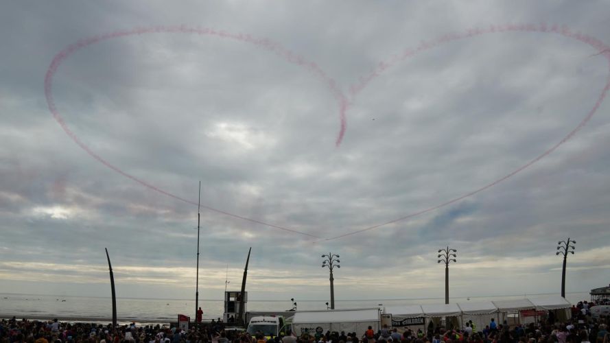 A heart-shaped vapour trail hangs in a cloudy Blackpool sky (Picture: Red Arrows X)  Red Arrows leave a heart shaped trail against a cloudy Blackpool sky