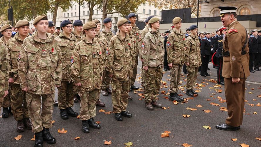 A Coldstream Guards Warrant Officer ensures Army and Sea Cadets form up correctly at the Cenotaph