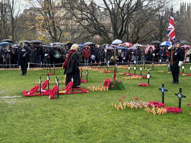 Crowds gather in the rain at the Edinburgh Garden of Remembrance to mark Armistice Day