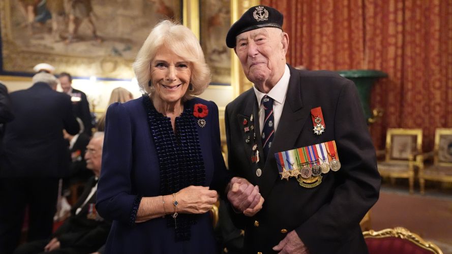 Queen Camilla and veteran Henry Rice at a reception for veterans who served in Pacific during WW2, part of commemorations marking the 80th anniversary of VJ Day, at Windsor Castle