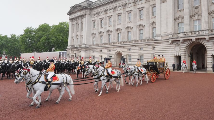 King Charles III and Queen Camilla travel in the Irish State Coach as they depart Buckingham Palace (Picture: PA) 13052026 state opening of parliament cred PA