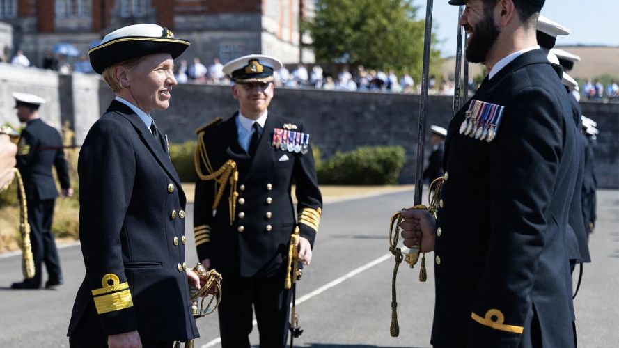 Rear Adm Singleton chats with the passing-out officers watched by BRNC's Captain, Captain Simon Cox (Picture: Royal Navy) Rear Adm Singleton chats with the passing-out officers watched by BRNC's Captain, Captain Simon Cox (Picture: Royal Navy)